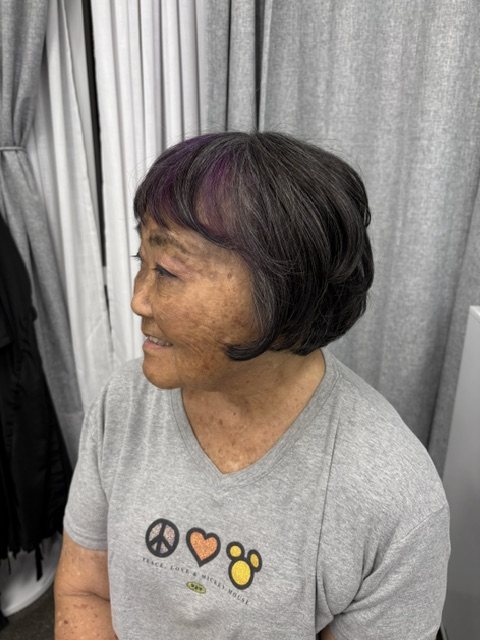 Short dark bob with a violet peekaboo panel