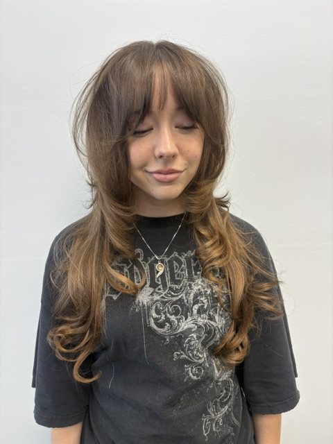 Long layers and curtain bangs, front view
