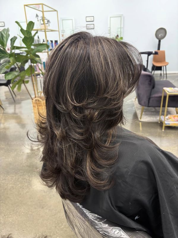 Back view of a graduated layered cut with highlights