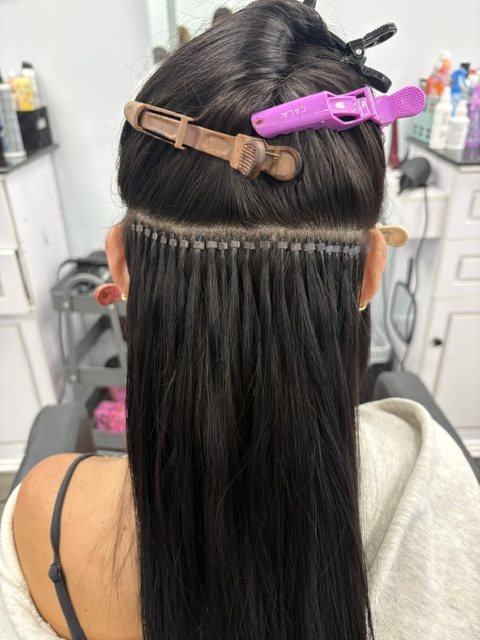 I-tip rows beaded into dark hair before blending
